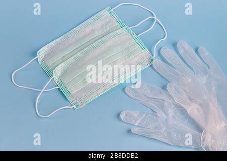 A sanitary mask helps prevent the entry of the Corona virus or other diseases. Alcoholic antiseptic cleanses hands and face from infection. Gloves, ha Stock Photo