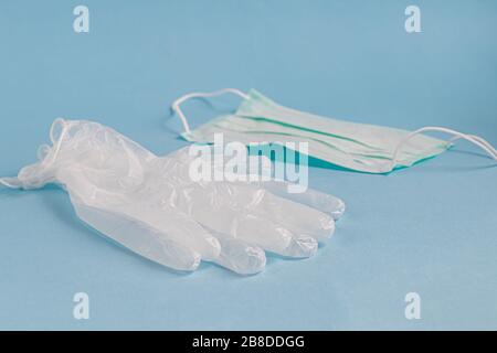 A sanitary mask helps prevent the entry of the Corona virus or other diseases. Alcoholic antiseptic cleanses hands and face from infection. Gloves, ha Stock Photo