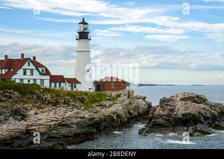 Portland Head lighthouse is the oldest lighthouse in Maine. The beacon shines brightly during low tide. Stock Photo