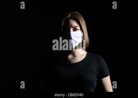 Protective respiratory mask for people that reduces the risk of infection with viruses and bacteria. Stock Photo