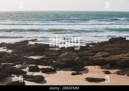 Rocks and Sands on the Seashore of El Palmar de Vejer, Cadiz, Andalusia Spain Stock Photo