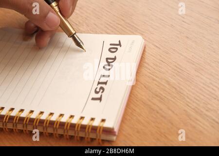 man hand writing To do list on notepad  Stock Photo
