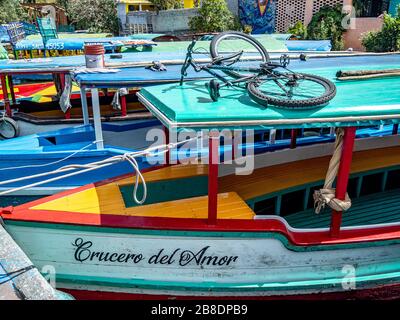 Colorful boats used by Mexicans for week-end parties on the canals of Xochimilco. Stock Photo