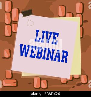 Word writing text Live Webinar. Business photo showcasing presentation lecture or seminar transmitted over Web Paper stuck binder clip colorful backgr Stock Photo