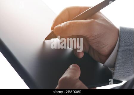 Writing on digital tablet close up view. Sign digital contract Stock Photo
