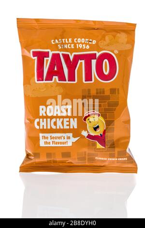 Winneconne,  WI - 17 March 2020:  A package of Tayto roast chicken chips on an isolated background. Stock Photo