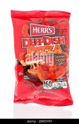 Winneconne,  WI - 17 March 2020:  A package of Herrs deep dish pizza cheese curls on an isolated background. Stock Photo