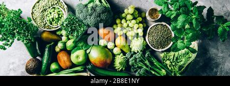 Variety of Green Vegetables and Fruits on the grey background, banner size Stock Photo
