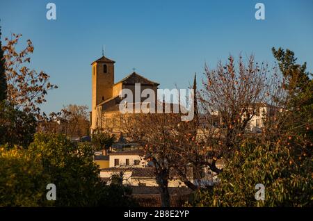 View to church of San Cristobal from Placeta Cristo de las Azuzenas viewpoint in the city of Granada, Spain Stock Photo