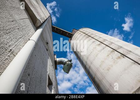 Industrial white silos in modern factory interior Stock Photo - Alamy