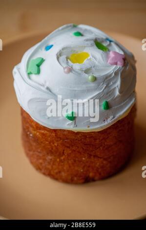 Easter cupcake on a plate. Easter, cupcake, holiday. Plate with easter cupcake. Easter is coming Stock Photo
