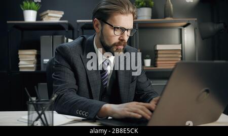 Middle-aged businessman working on computer Stock Photo