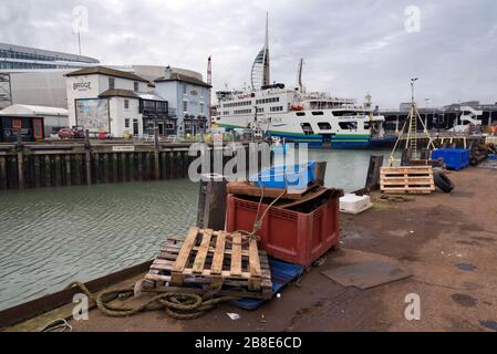 The historic Bridge Tavern and the Isle of Wight Ferry and its terminal at Camber Dock, Portsmouth, UK. Seen from Camber Quay fish dock. Stock Photo