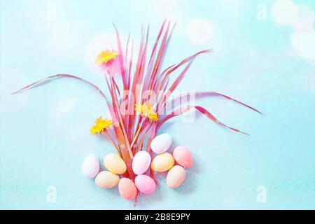 Easter eggs and flowers on blue background Stock Photo