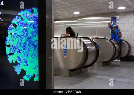 Commuters on the London Underground during coronavirus lockdown, March 2020 Stock Photo