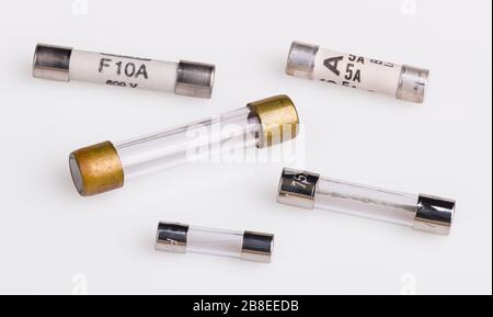 Set of miniature electrical fuses for overcurrent protection. Safety electronic components group. Metal fusible wire or strip in ceramic or glass tube. Stock Photo