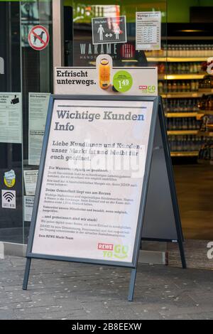 Effects of the coronavirus crisis, empty shopping street, notice at a food market, Hohe Strasse in Cologne, Germany, Stock Photo