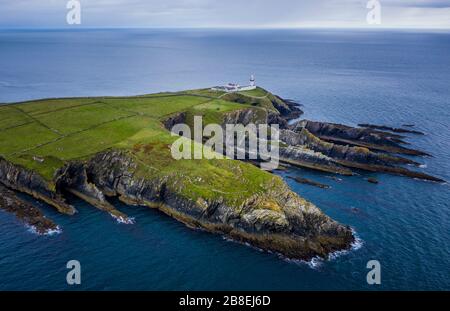 Galley Head Lighthouse is an active 19th century lighthouse outside of Rosscarbery, County Cork, on the south coast of Ireland. Stock Photo