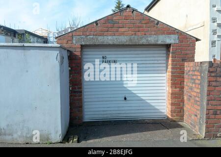 Bristol-March 2020-England-a close up view of a no parking sign of a garage door that leads onto the main road Stock Photo