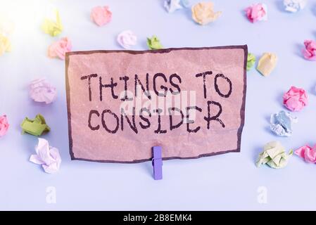 Handwriting text writing Things To Consider. Conceptual photo think about something carefully in order to make decision Colored crumpled papers empty Stock Photo