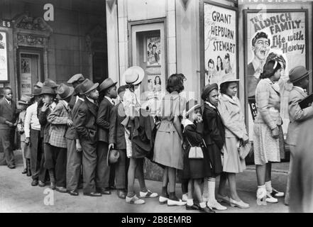 Children in front of Moving Picture Theater, Easter Sunday Matinee, Black Belt, Chicago, Illinois, USA, Edwin Rosskam for U.S. Farm Security Administration, April 1941 Stock Photo