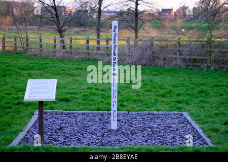 The Peace Pole with words: May peace prevail on Earth. Installed by the Religious Society of Friends (Quakers) in Stone, Staffordshire, UK. Stock Photo