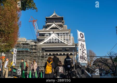 Tourists visiting Kumamoto Castle in New Year holiday. The castle sustained damage in earthquake on 2016. Stock Photo