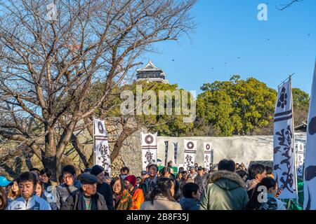 Tourists visiting Kumamoto Castle in New Year holiday. The castle sustained damage in earthquake on 2016. Stock Photo