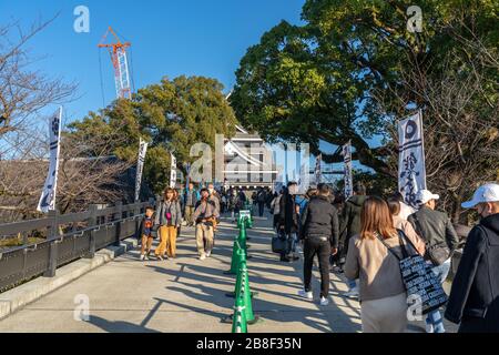 Tourists visiting Kumamoto Castle in New Year holiday. The castle sustained damage in earthquake on 2016. Stock Photo