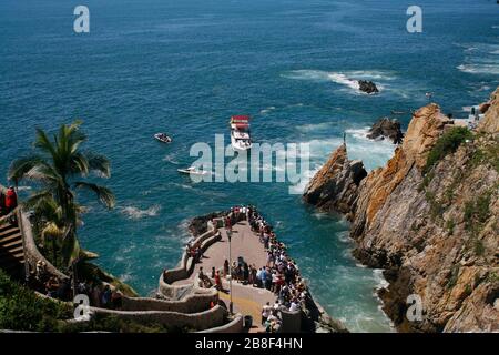 Watching cliff divers in Acapulco, Mexico Stock Photo