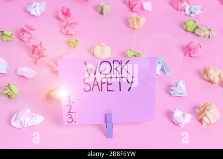 Handwriting text writing Work Safety. Conceptual photo policies and procedures in place to ensure safety in workplace Colored crumpled papers empty re Stock Photo