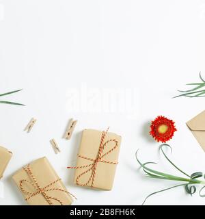 Gift boxes with floral decoration. Flat lay, top view, copy space Stock Photo