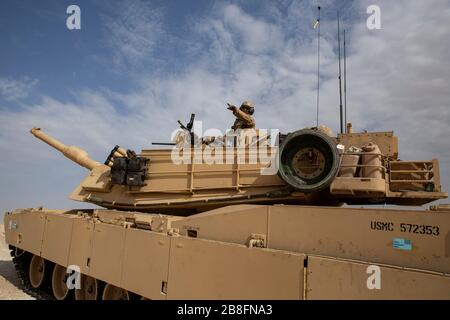 U.S. Army 1st Lt. Matthew Linarelli and Capt. Michael White (background ...