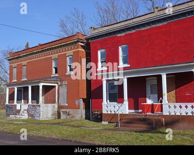 Derelict old houses with boarded up windows Stock Photo