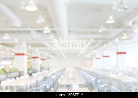 blur image canteen dining hall room white, eating food in university canteen blur background, blurred background cafeteria white in interior Stock Photo