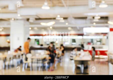 Blur image Canteen Dining Hall Room, A lot of people are eating food in University canteen blur background, Blurred background cafe or cafeteria Stock Photo