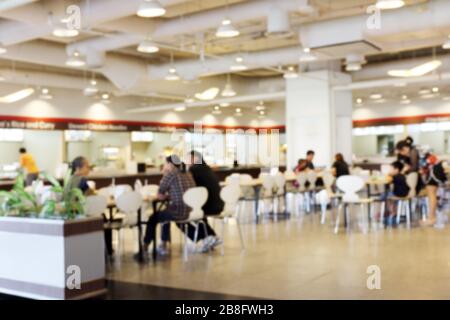 Blur image Canteen Dining Hall Room, A lot of people are eating food in University canteen blur background, Blurred background cafe or cafeteria Stock Photo