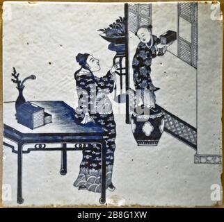Blue and white ceramic tile with figurine design. Wuhan Museum, China Stock Photo