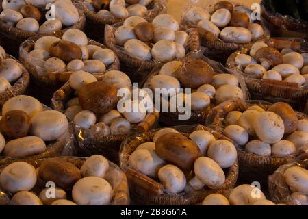 Small baskets of mixed mushrooms at an open air farmers market Stock Photo