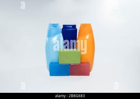 Close-up of soap and shampoo bottles in 3 different colors. Soap on the front and shampoo skewers on the back. Stock Photo