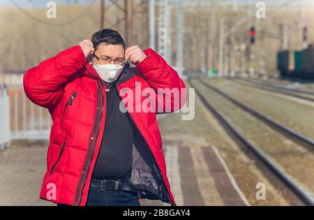 person standing on the platform of a railway station Stock Photo