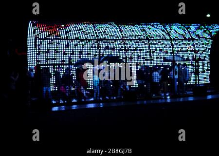 A matrix of spots, a light tunnel installation at VIVID Sydney 2013, a rainy night the annual event of light sculptures and creative illuminated art Stock Photo