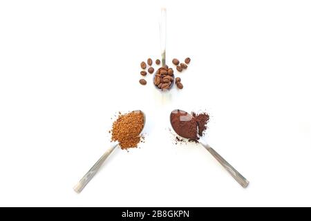 Cereal and instant and ground coffee in three spoons isolate. Spoon with instant coffee and coffee beans, retro style toned, copy space. Stock Photo