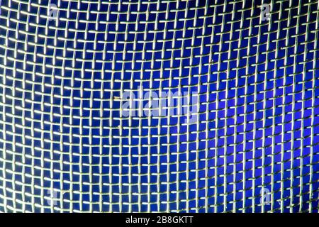 Macro image, blue lit light, metal mesh Stock Photo