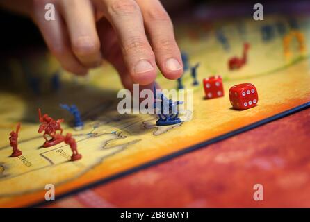 Kaufbeuren, Germany. 21st Mar, 2020. A family plays the board game 'Risk' in their house. (to dpa-KORR: 'Lagerkoller or a chance? How to (survive) in isolation' from 22.03.2020). Credit: Karl-Josef Hildenbrand/dpa/Alamy Live News Stock Photo