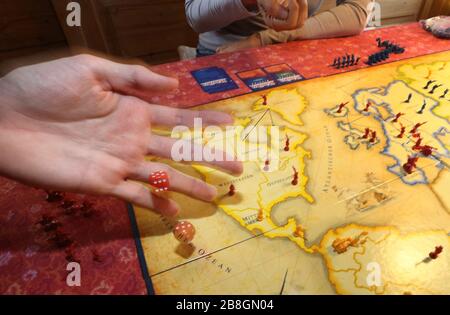 Kaufbeuren, Germany. 21st Mar, 2020. A family plays the board game 'Risk' in their house. (to dpa-KORR: 'Lagerkoller or a chance? How to (survive) in isolation' from 22.03.2020). Credit: Karl-Josef Hildenbrand/dpa/Alamy Live News Stock Photo