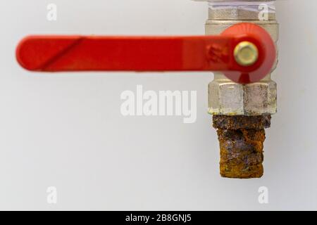 Exterior rusty tap isolated on white wall background Stock Photo
