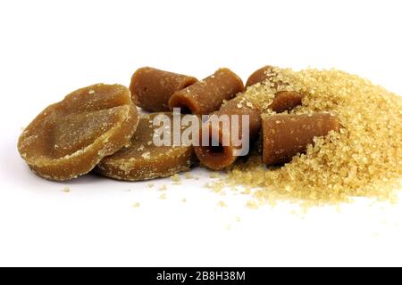 Sugar, Sugar solid concentrate, Reed Sugar cubes brown from Sugarcane and various kinds of sugar brown cubes round sphere on white background Stock Photo