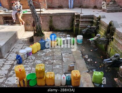 Kathmandu, Nepal. 22nd Mar, 2020. Water jars are seen near a traditional stone tap in Kathmandu, Nepal, March 22, 2020. Credit: Sunil Sharma/Xinhua/Alamy Live News Stock Photo