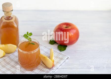 Freshly squeezed apple juice on a white background. Useful vitamin, antiviral drink. Copy space Stock Photo